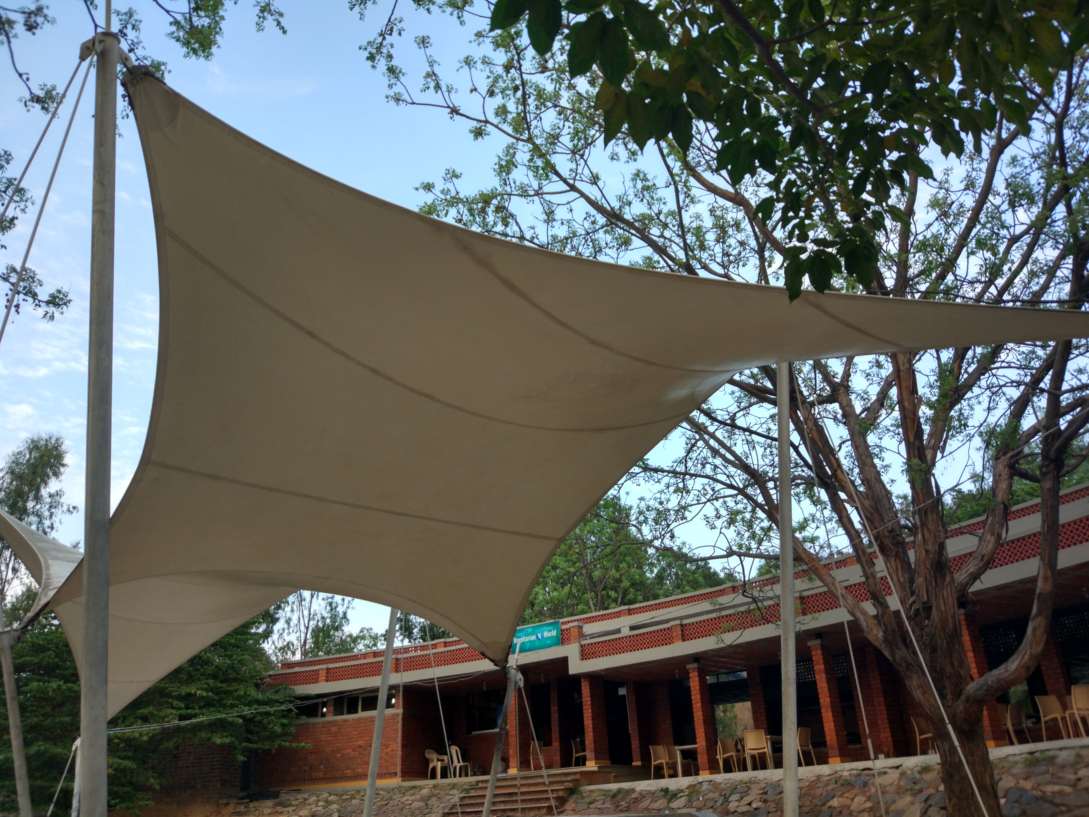 Tensile shade canopy over the outdoor cafeteria seating area