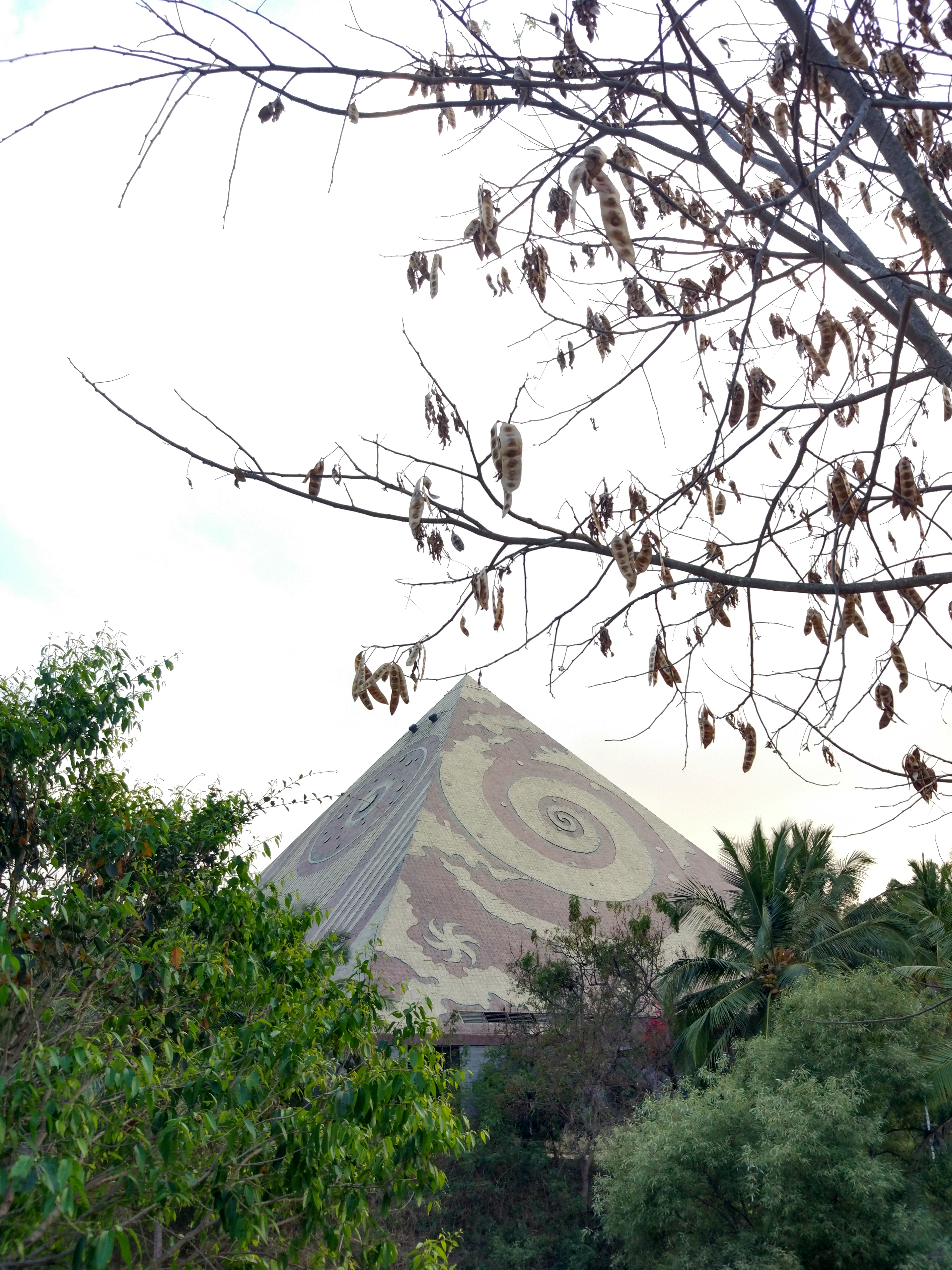 Maitreya Buddha Pyramid exterior with spiral and celestial surface patterns